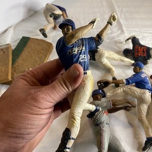9 Baseball figures. Please look at pix. Not 4 “bases”.
